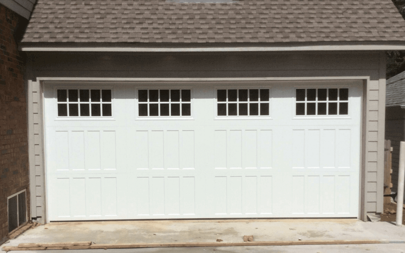 carriage style residential garage door with windows