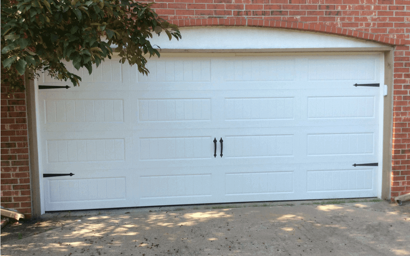 residential garage door with decorative hardware