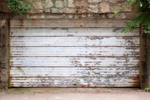 Old garage door with rust and chipped paint