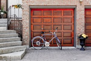Wood Garage Door with a bicycle in front of it